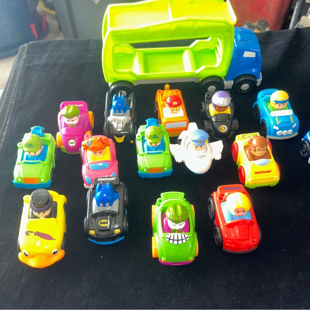 16 piece lot of fisher  price little people, willies and transport.